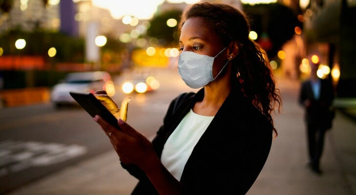 Woman using her online trading app