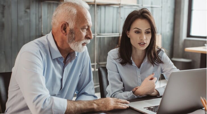 Father and daughter looking for unclaimed retirement benefits.