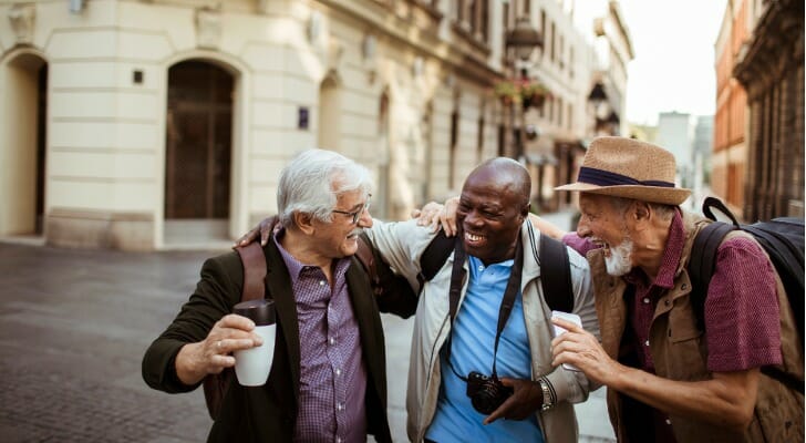 Three retired men enjoying a vacation together.