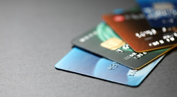 Image shows four credit cards stacked on top of one another. SmartAsset analyzed various data points to find where residents most rely on credit.