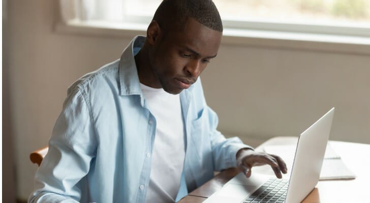 A man prepares a Schedule K-1 form.