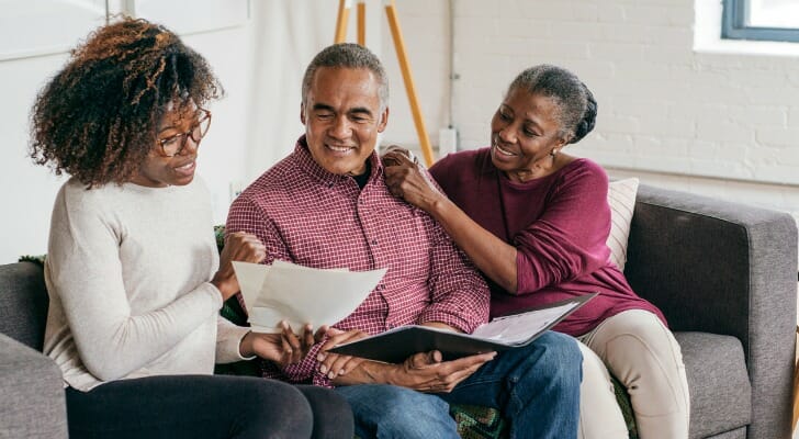 A couple and their advisor discuss what to do with a $50k inheritance.