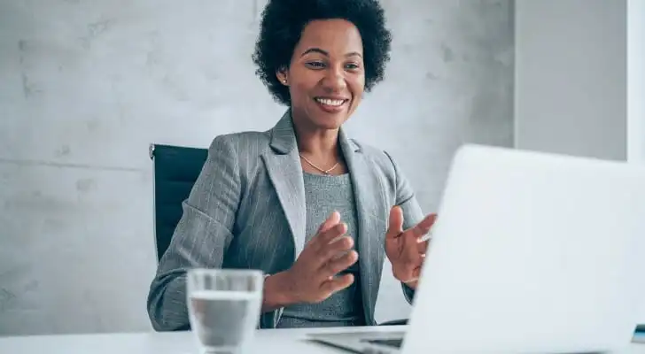 A woman deciding it is worth paying a financial advisor.