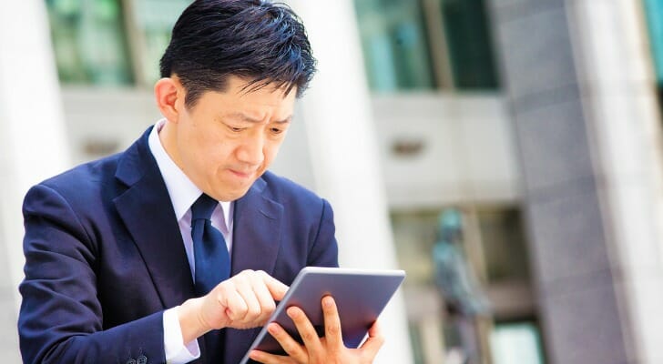 Business man checks his portfolio