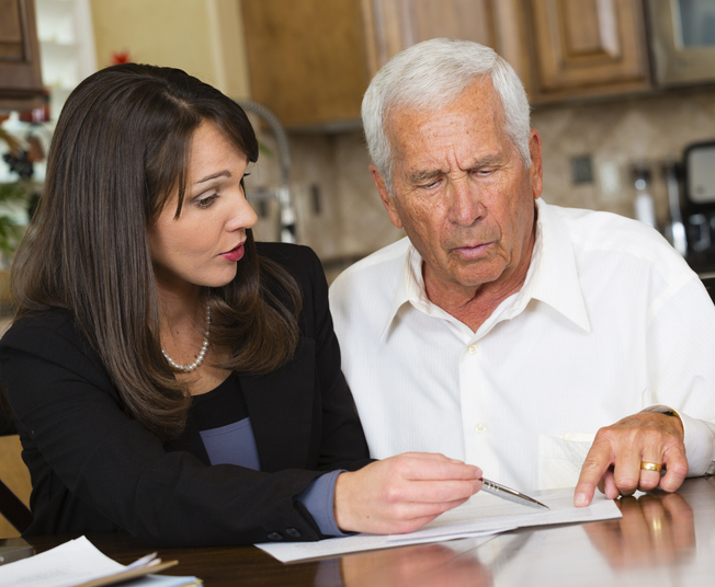 An advisor and client review what is a fiduciary deed.