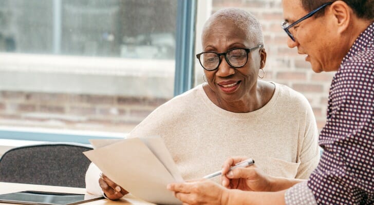 A financial advisor discusses with his client changing the executor of her will.