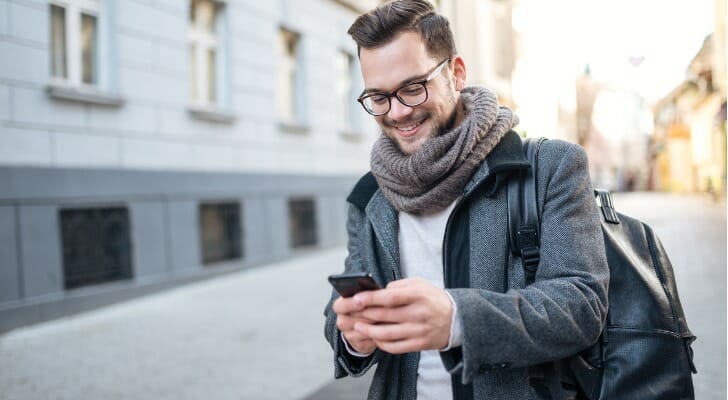 Man using his mobile trading app.
