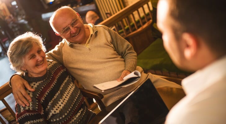 Senior couple discussing what to do with their 401(k) money.