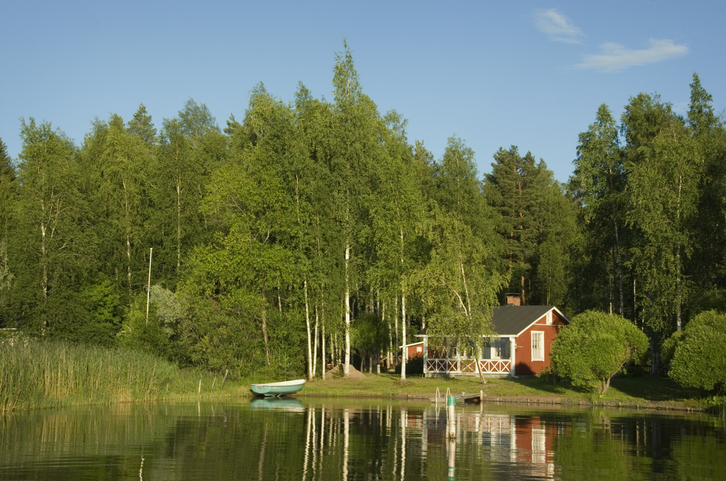 A cabin on a lake in Finland.