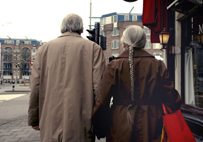 A couple who retired in the Netherlands taking a walk.