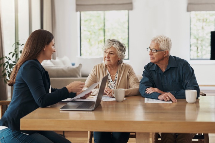 senior couple meets with an advisor to talk over their estate plan