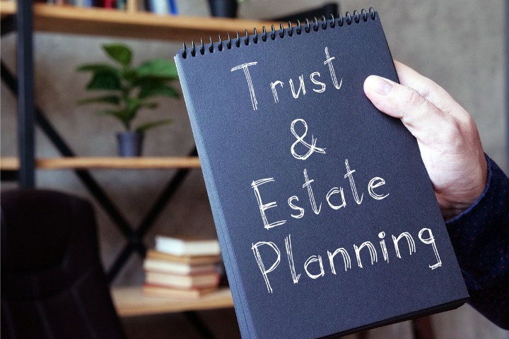 Notebook that says "Trust and Estate Planning"