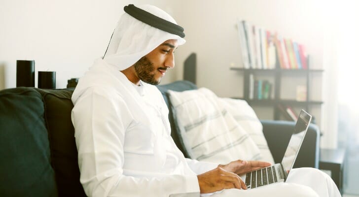 An investor comparing thinkorswim vs. E*TRADE.