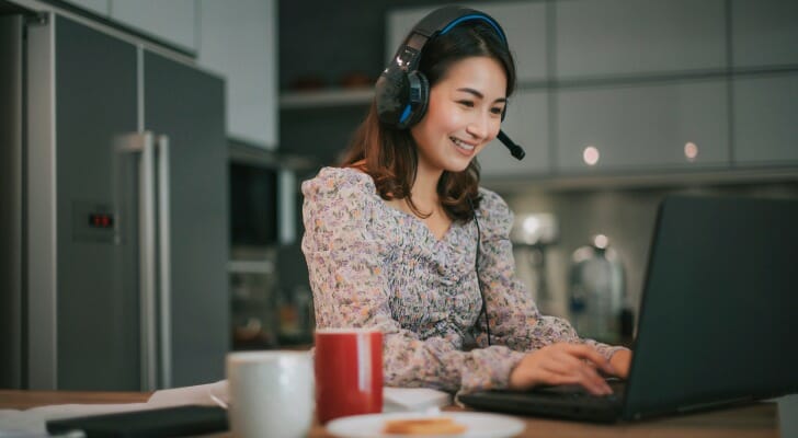 An Asian woman doing her investing