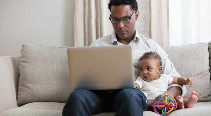 Man with baby at home.