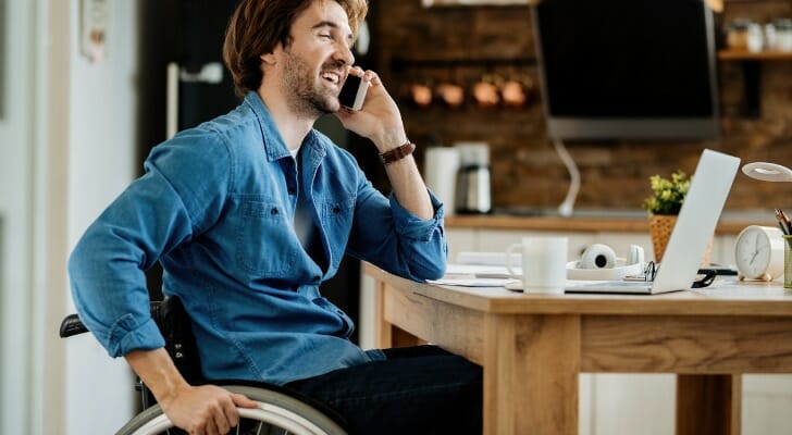 A wheelchair-bound man at work