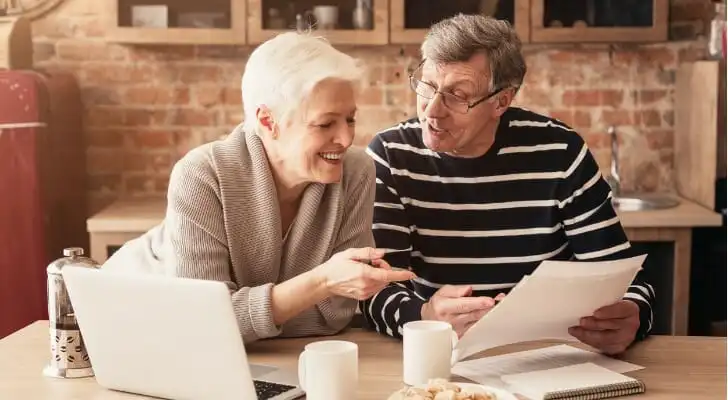 A couple review how to withdraw money from your 401(k).