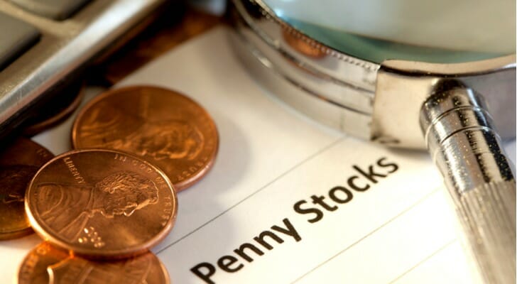 Pennies on top of financial documents.