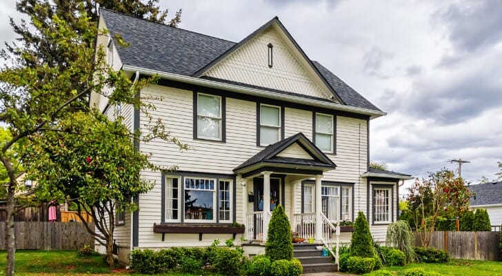 Image shows a house with a lawn in a residential neighborhood. SmartAsset analyzed data from the Census Bureau for the 50 largest U.S. cities to conduct its latest study on where residents spend the most and least on housing.