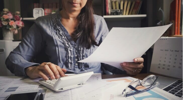 Woman filing investment tax forms