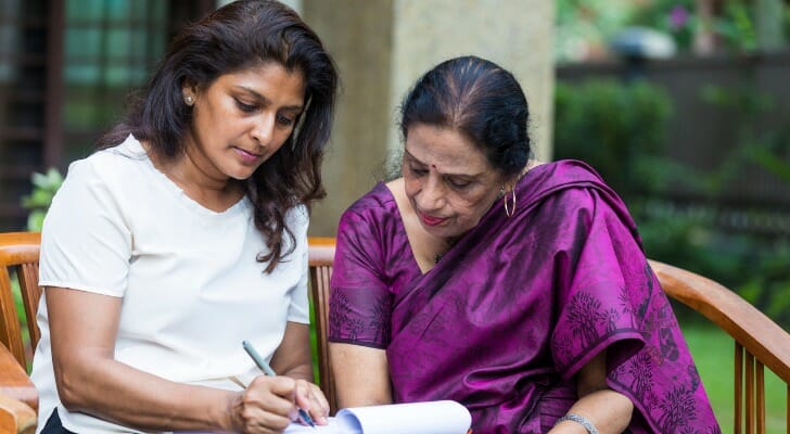 Mother and daughter study payable on death document.