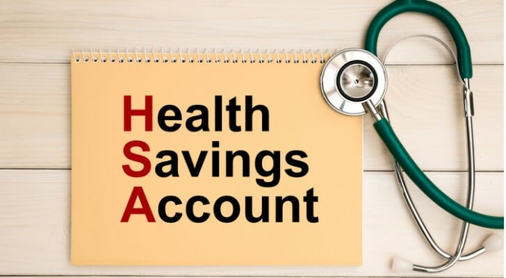 "Health Savings Account" written on notebook cover. You can roll over a HSA from year-to-year and eventually use it as a retirement account.