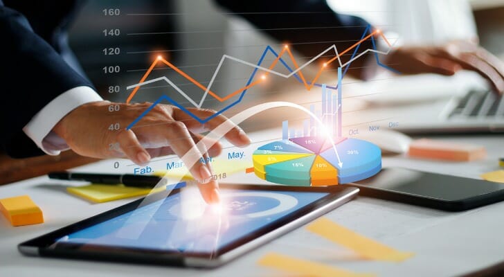 An investor uses a tablet to work on his portfolio.