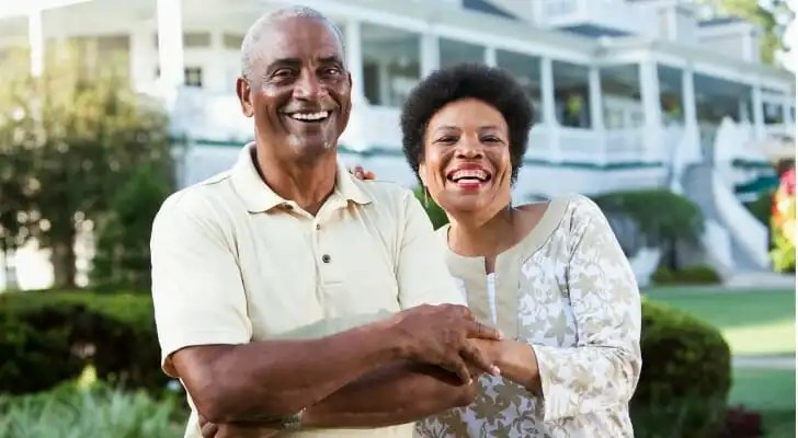 A husband and wife discussing how to retire with $5 million.