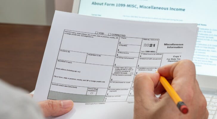 Man holds a 1099 form