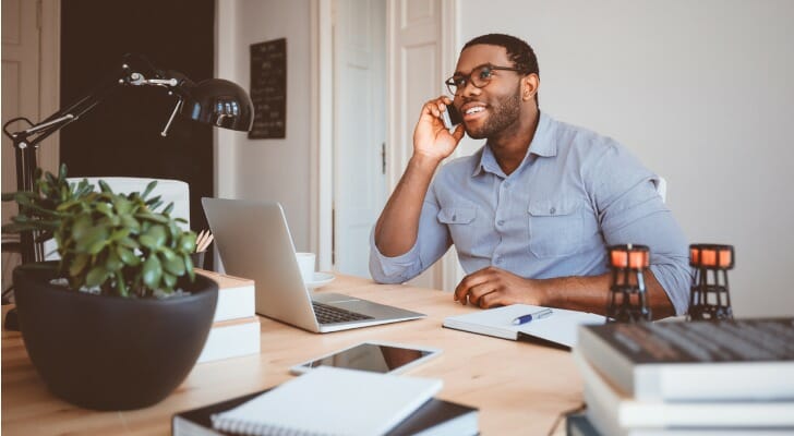 A financial advisor cold calls a potential client.