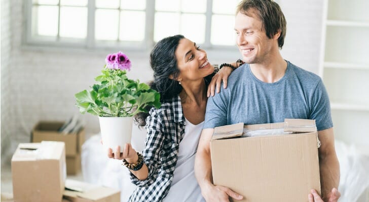A young couple moves into a new home. SmartAsset compiled a list of states where rich young professionals are moving to the most.