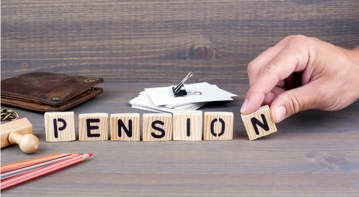 "PENSION" written in wooden blocks