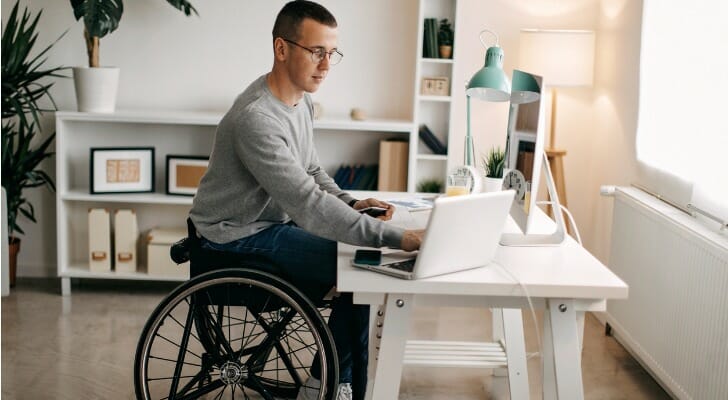 A stock investor reviewing different types of stock charts.