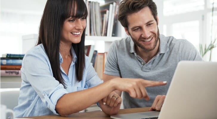 A couple review a hedge fund vs index fund.