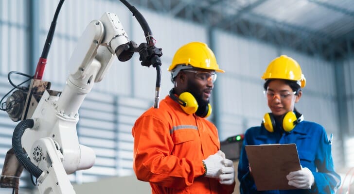 Image shows a man and woman engineer at work. SmartAsset analyzed BLS data to identify the occupations in which women earn more than men.