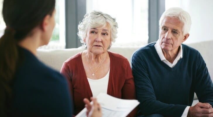 A couple sit down with their financial advisor to discuss mega backdoor Roth options.