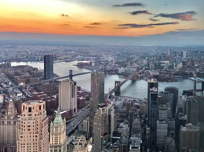 A city skyline. Financial investments in real estate are no longer limited to buying and selling property, or collecting rent.