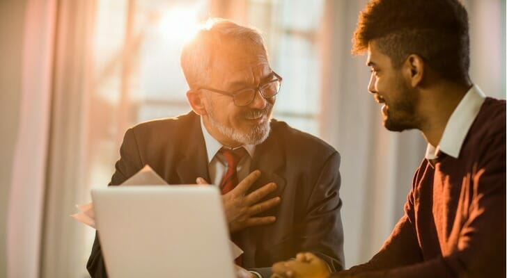 Image shows a client speaking to an investment consultant.