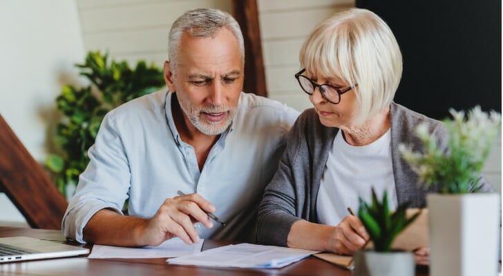 Couple checks their index funds.