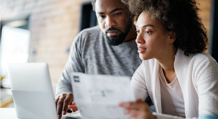 A couple reviewing capital gains tax on inherited property.