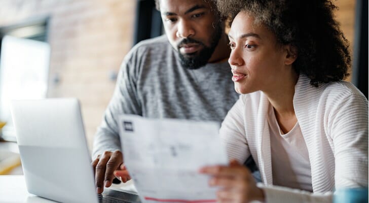 Young couple filing their taxes