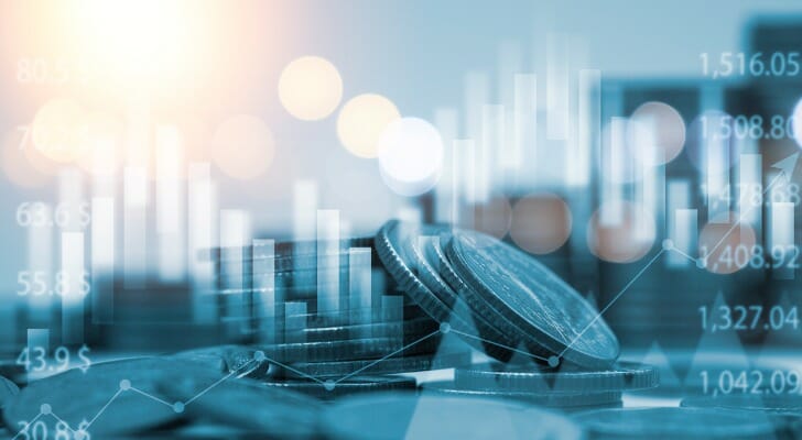 Graphic of a digital stock price display and stacks of coins.