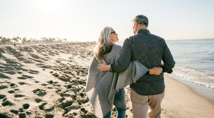 Retired couple walking on a beach