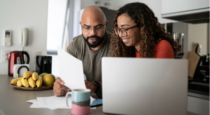 Couple working on their financial analysis.