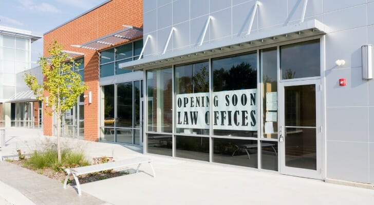 Image shows a strip mall. Strip malls remain a solid investment, either through direct purchase or investing in a real estate investment trust (REIT).