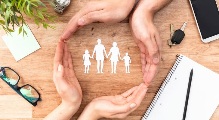 Pair of hands forming a circle around the silhouette