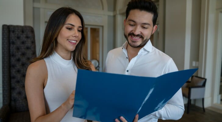 Couple looks at the deed to their house
