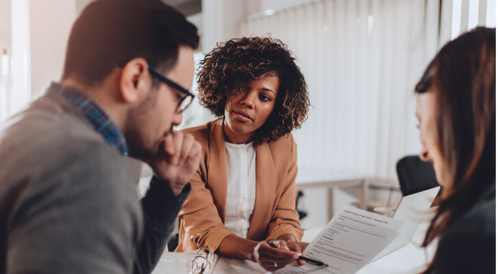 A financial advisor discussing the level of services that they can provide.