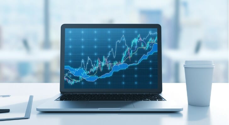 A laptop showing a stock chart.