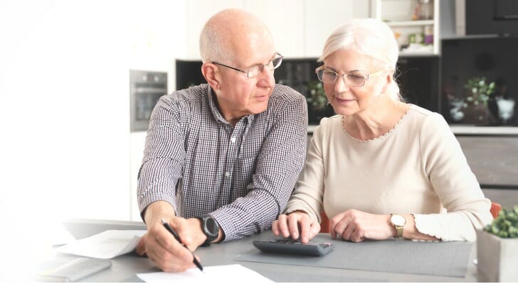 Senior couple checking their pooled income trust